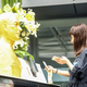 A golden bust of Steve Jobs displayed at a Shanghai Company